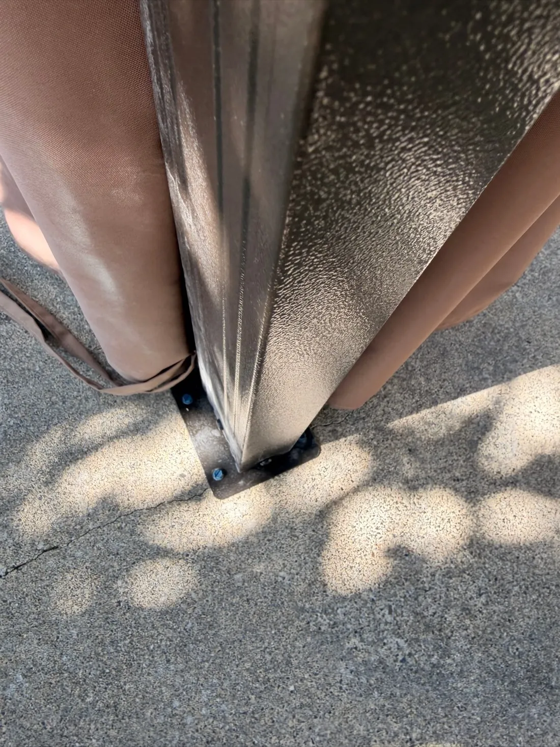 Gazebo post base plate bolted to a concrete pad with masonry anchors — Zomg The Handyman