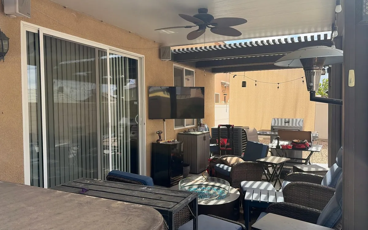 Outdoor TV mounted under a covered patio by Zomg