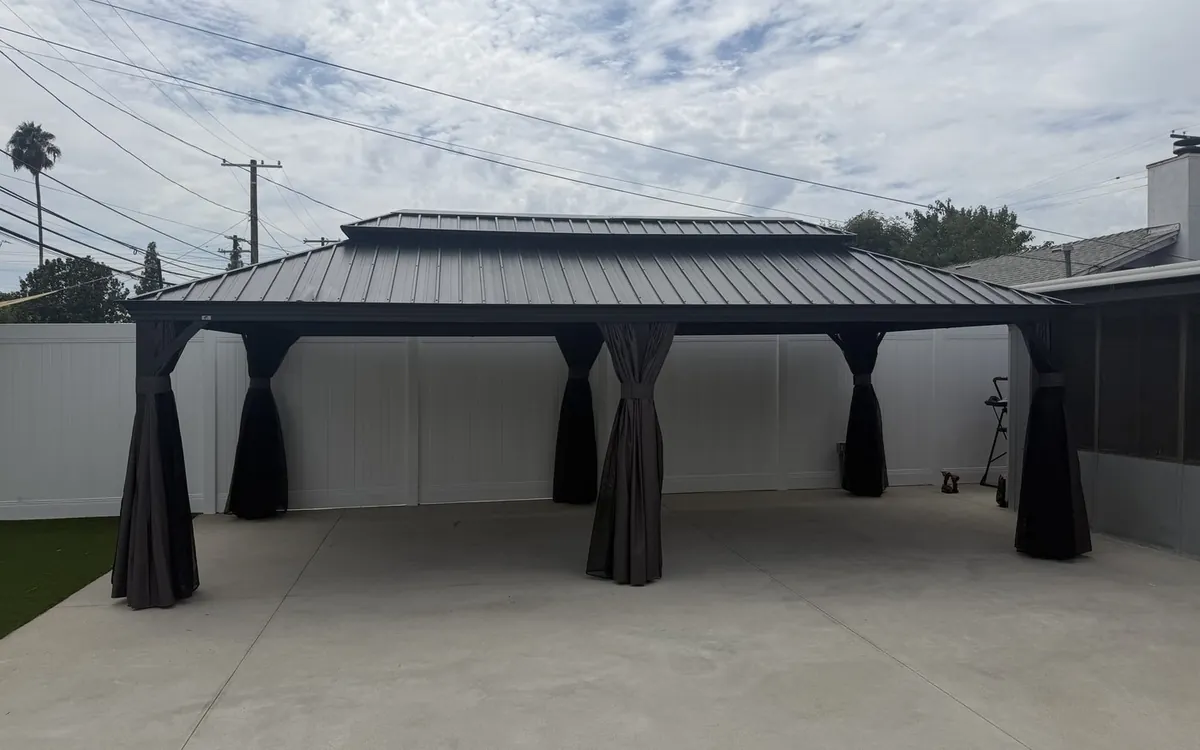 Double roof hardtop gazebo with privacy curtains, assembled by Zomg