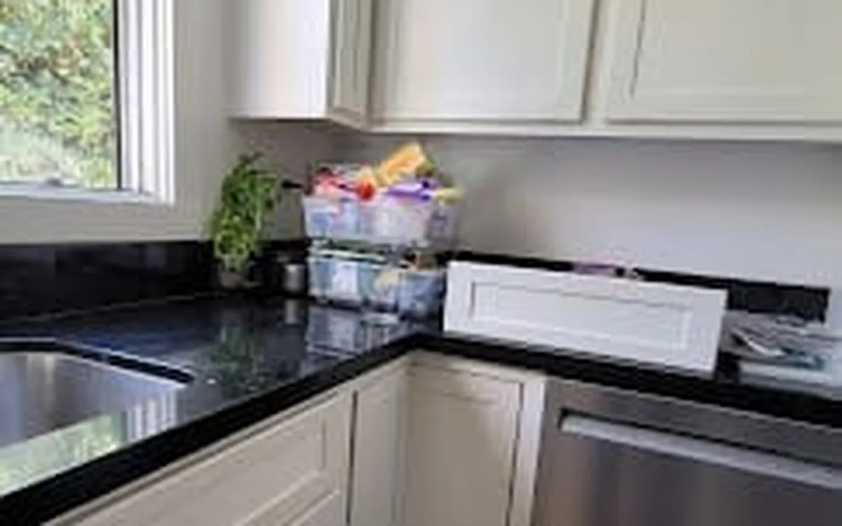 Dishwasher installed in a white kitchen
