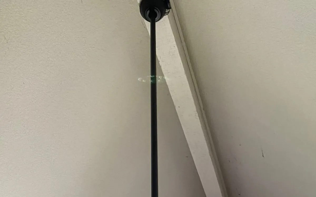 Ceiling fan on a downrod under a vaulted ceiling, installed by Zomg