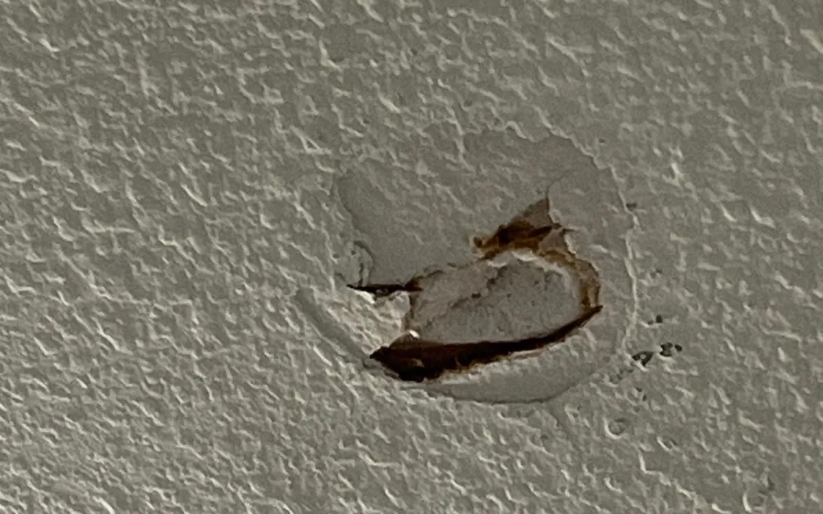 Textured drywall before the Zomg repair