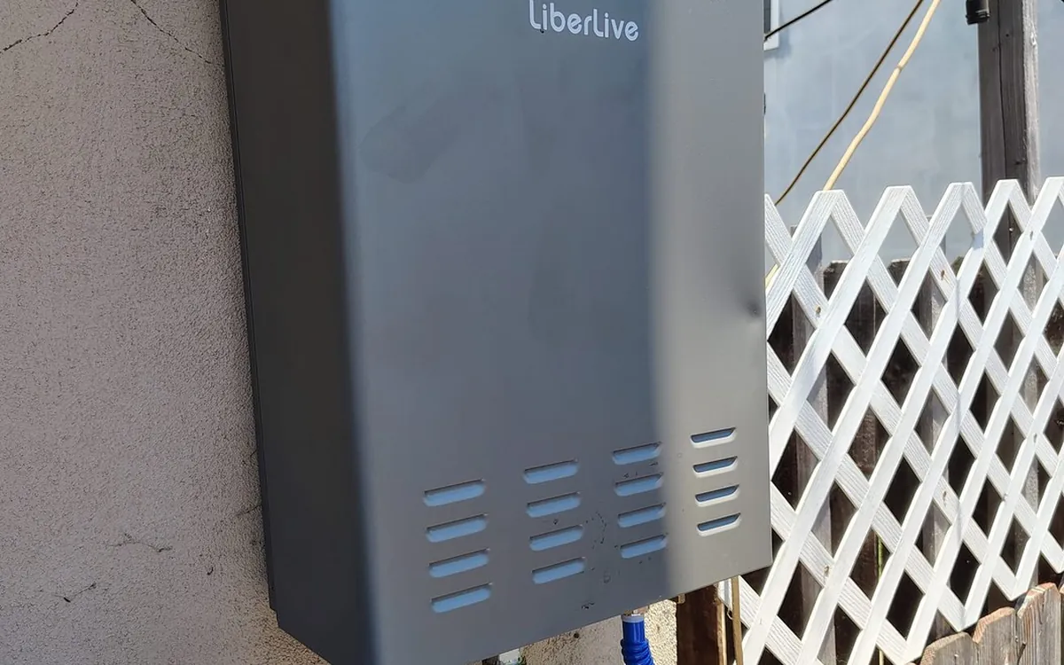 Tankless water heater mounted outside