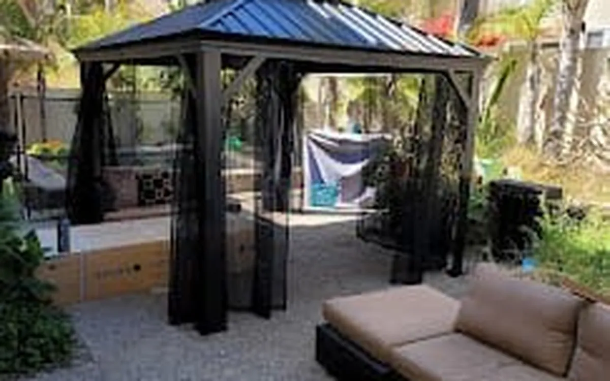 Hardtop gazebo assembled beside a pool by Zomg