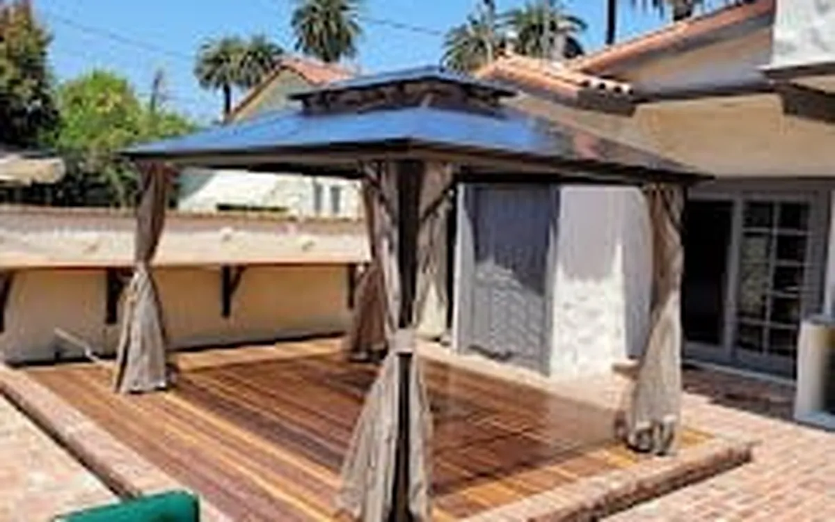 Cedar gazebo on a backyard deck, assembled by Zomg