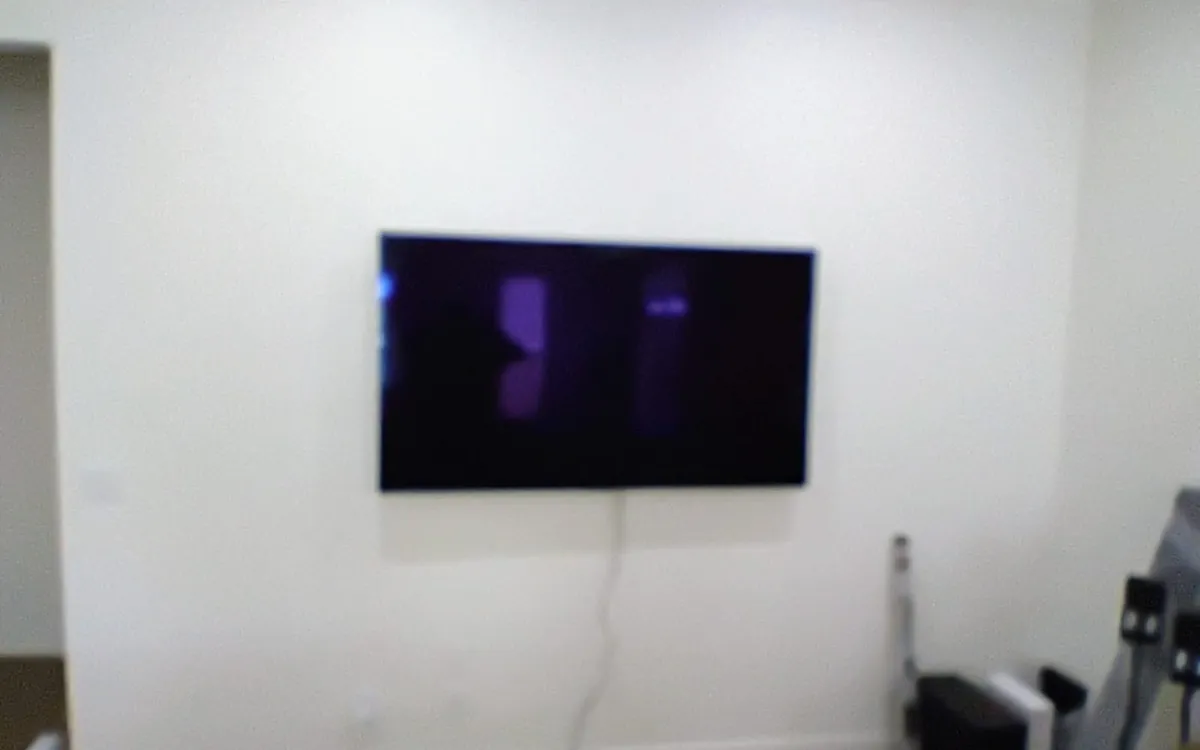 Big screen mounted flush with speakers below