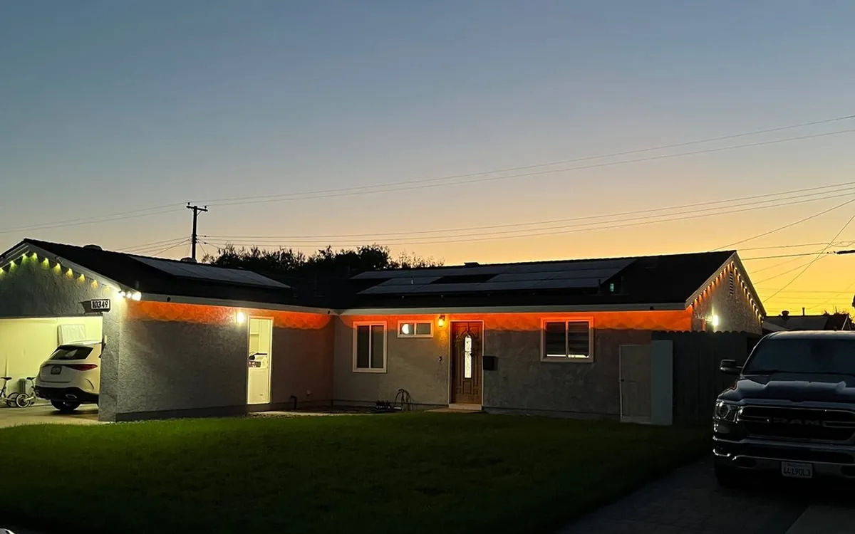 Outdoor lighting on a home at dusk, installed by Zomg