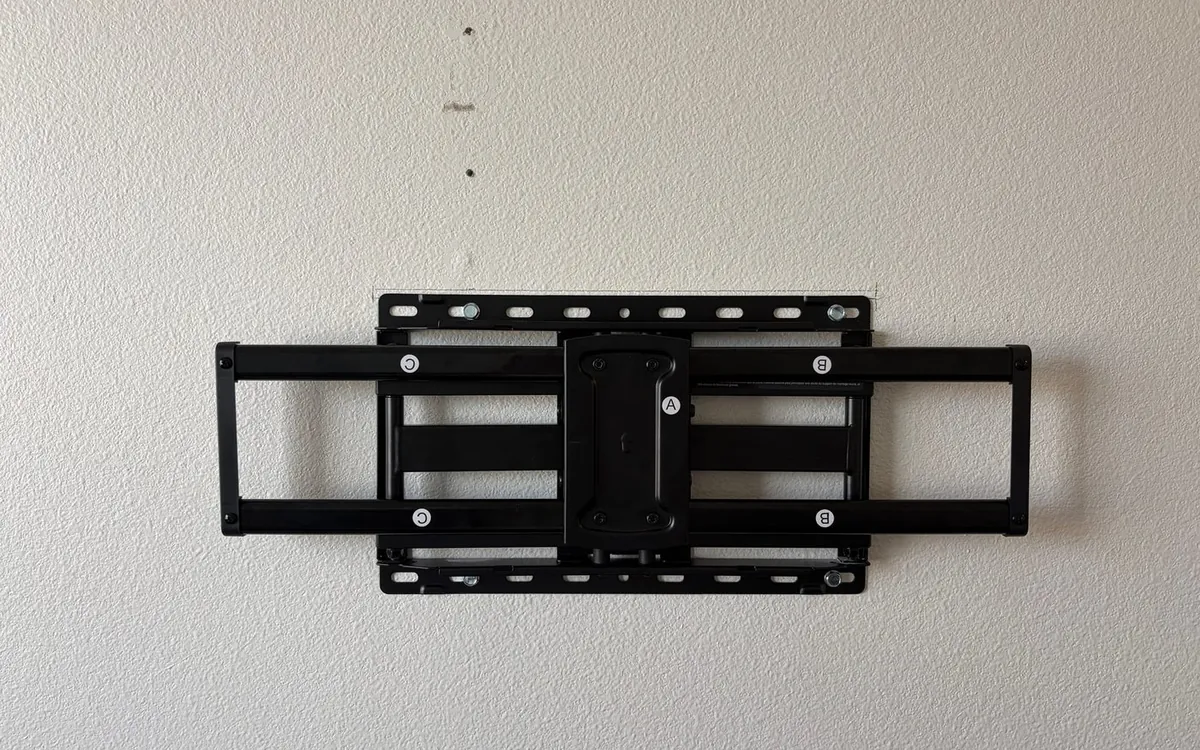 TV mount anchored into the studs by Zomg