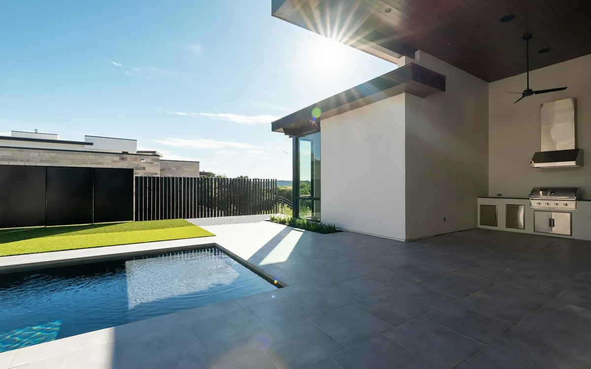 Outdoor kitchen beside a pool