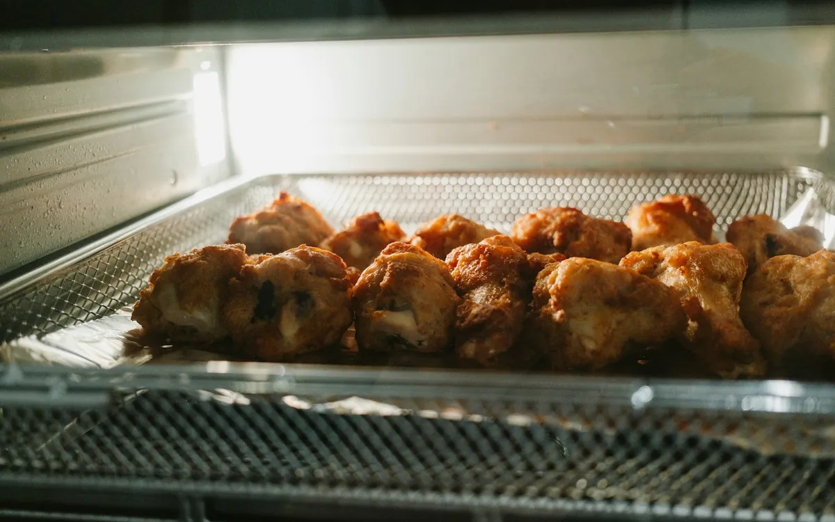 Food cooking in an air fryer basket