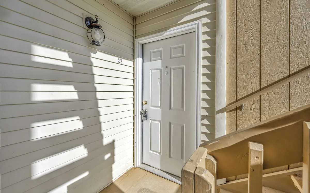 White front door with siding