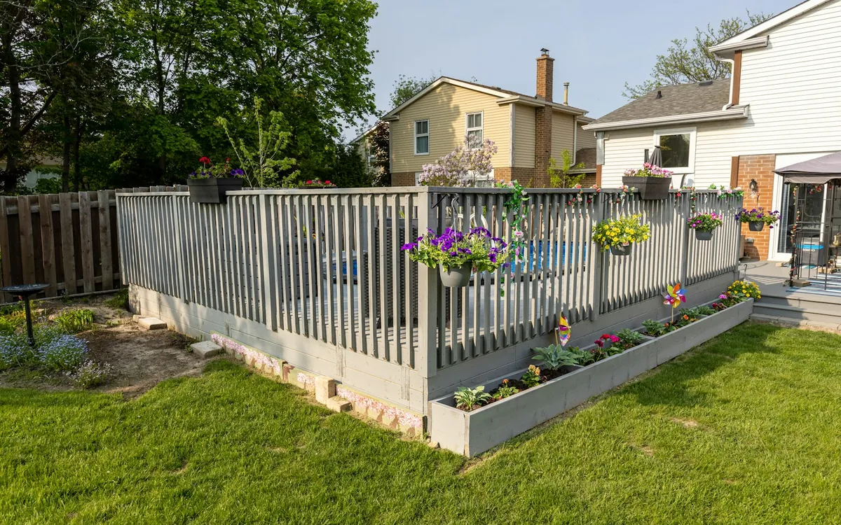 Backyard with a deck and a fence