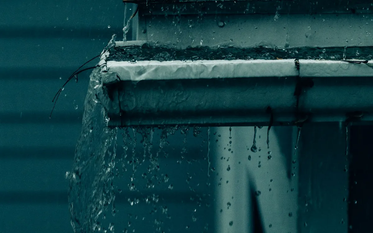 Water running off a roof edge