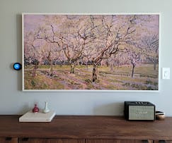 Samsung Frame TV displaying art, flush-mounted above a wood console — Zomg The Handyman